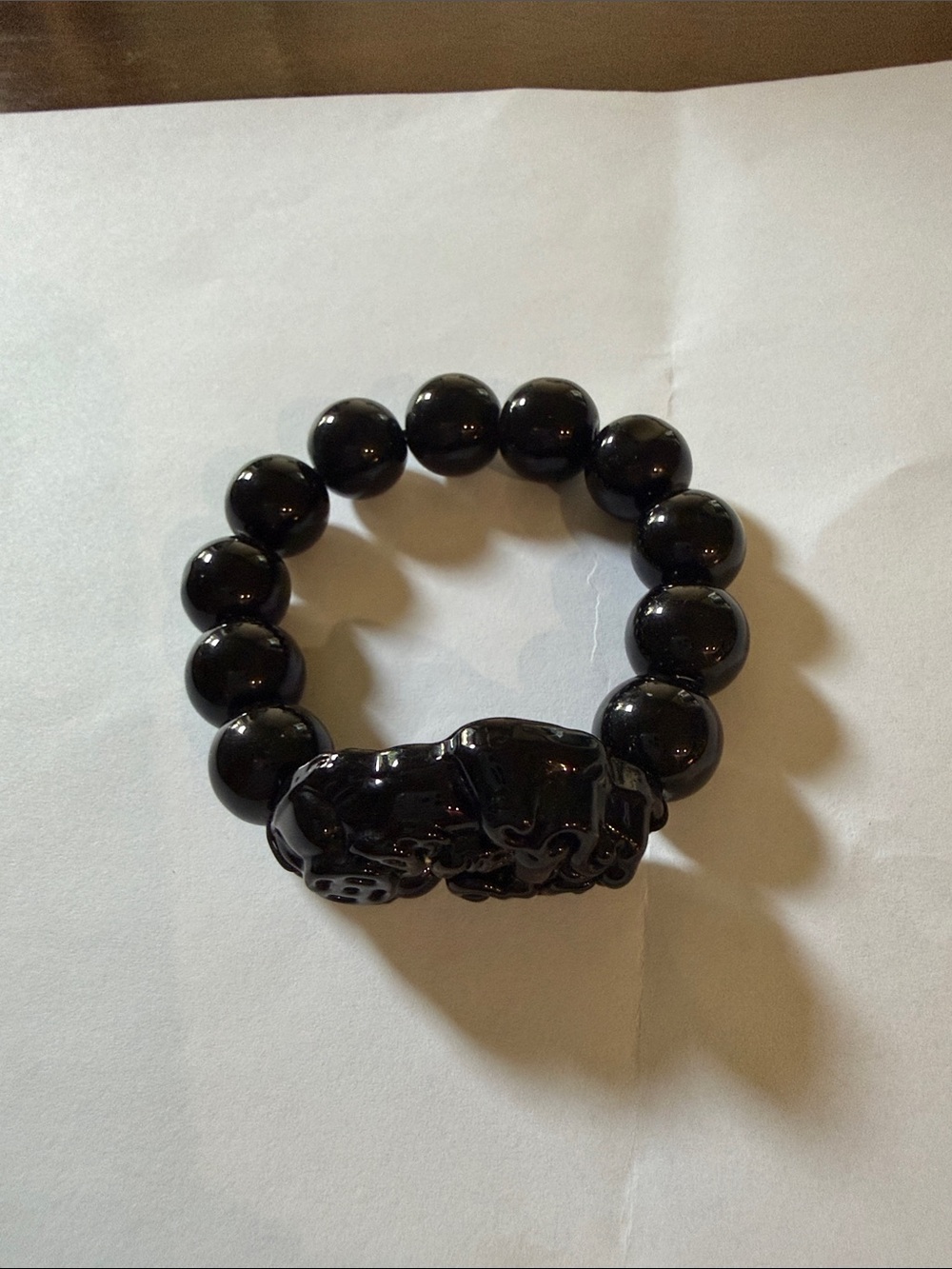 Black Beaded Stretch small Bracelet with Carved Animal Charm